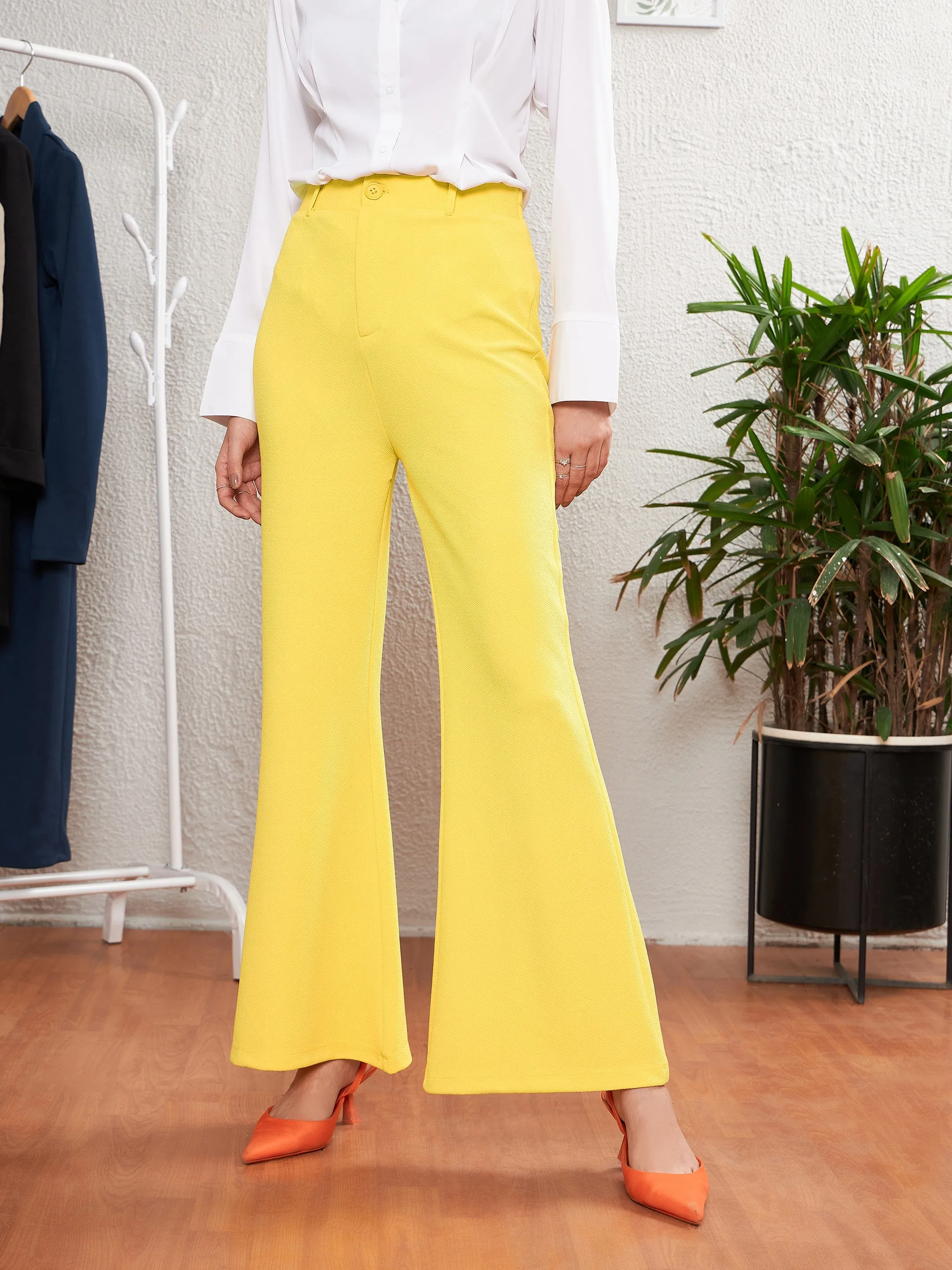 Women Yellow Sleeveless Blazer With Bell Bottom Pants